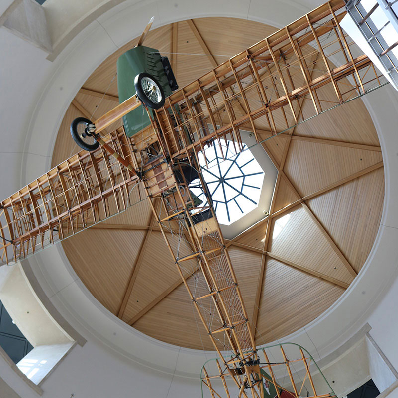 The Jenny airplane suspended from the ceiling of the Minnesota History Center.