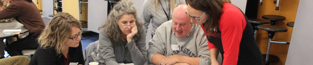 teachers looking at materials